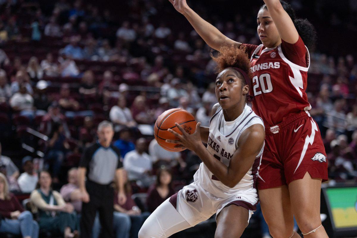 Texas A&M guard Kay Kay Green (4) drives to the basket during Texas A&Ms game against Arkansas on Thursday, Feb. 22, 2024, at Reed Arena. (Adriano Espinosa/The Battalion)