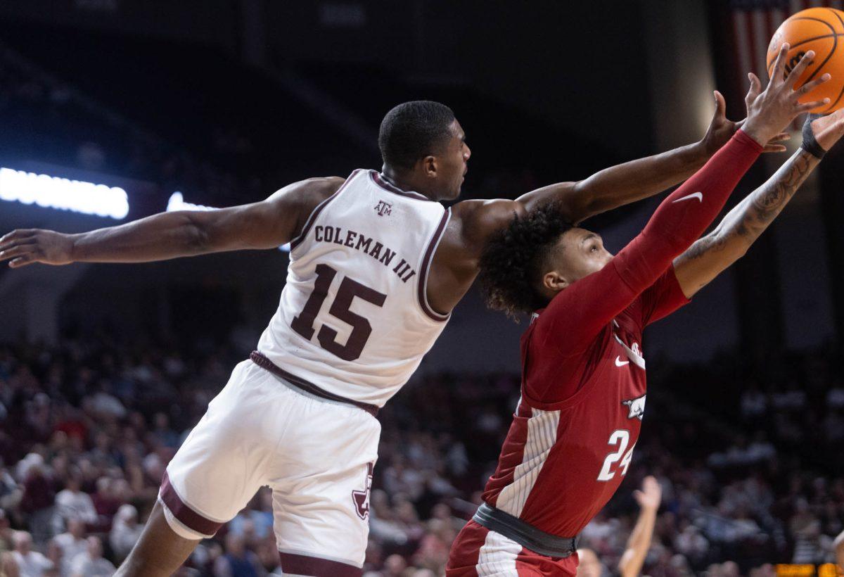 Senior F Henry Coleman (15) attempts to rebound the ball during Texas A&Ms game against Arkansas on Feb. 20, 2024 at Reed Arena. (Jaime Rowe/The Battalion)