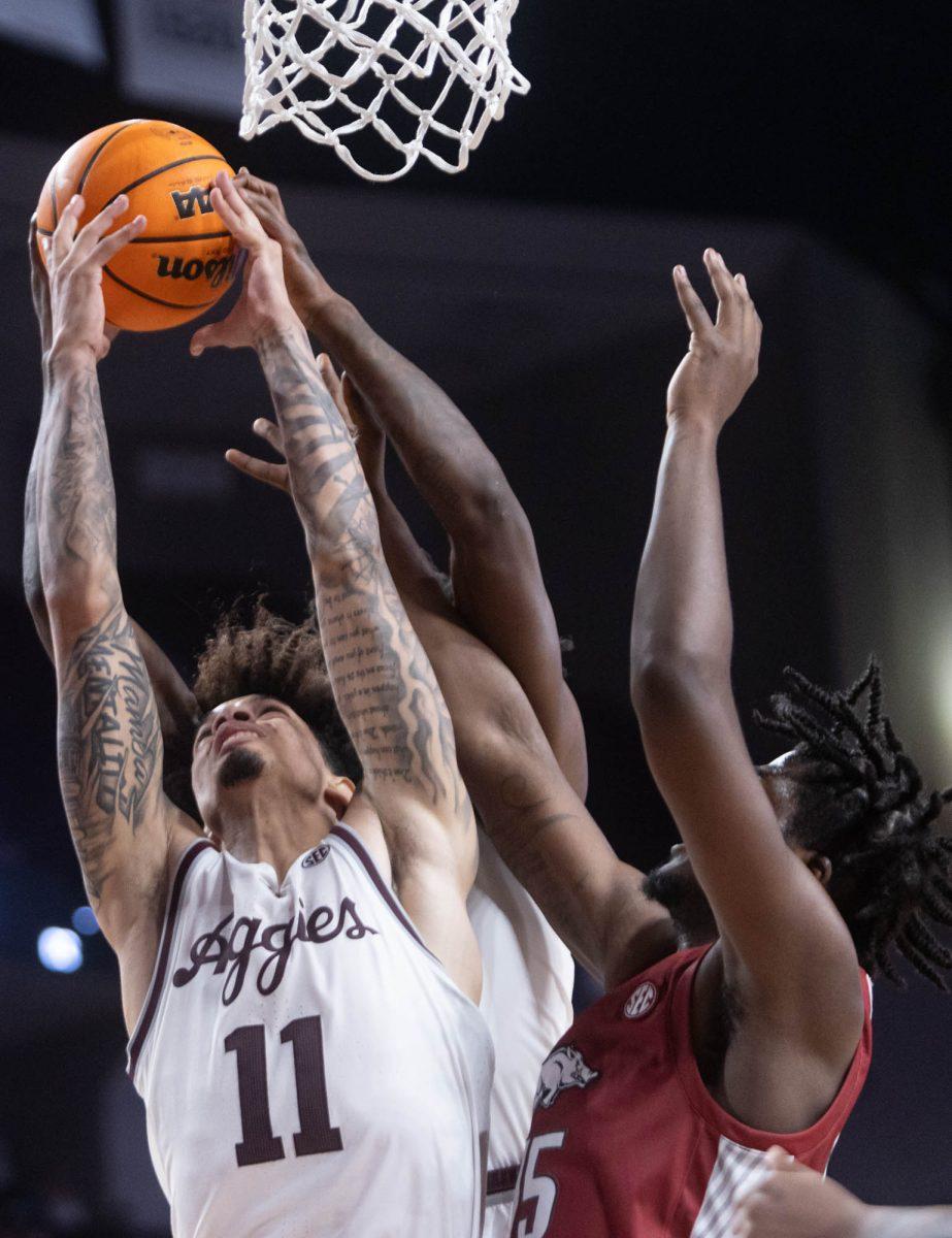 Senior F Andersson Garcia fights to rebound the ball during Texas A&Ms game against Arkansas on Feb. 20, 2024 at Reed Arena. (Jaime Rowe/The Battalion)