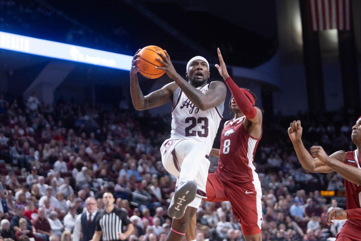 Graduate G Tyrece Radford (23) makes a layup during Texas A&Ms game against Arkansas on Feb. 20, 2024 at Reed Arena. (Jaime Rowe/The Battalion)