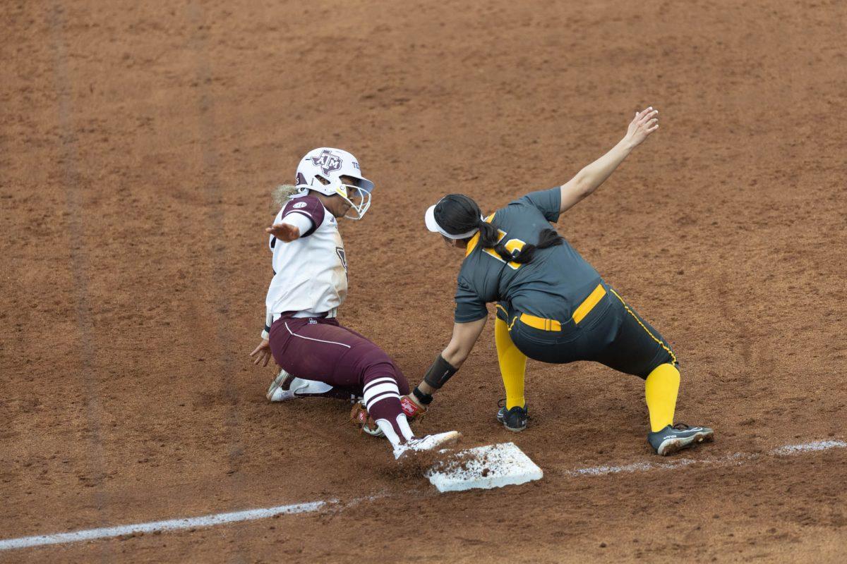 Sophomore INF Kennedy Powell (1) attempts to slide into third base during Texas A&Ms game against Valpo on Feb. 10, 2024 at Davis Diamond.