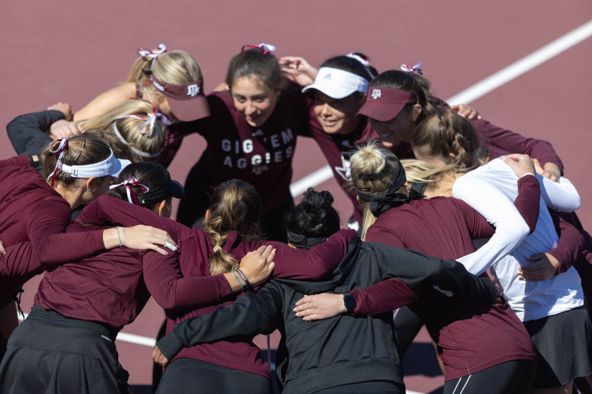The Texas A&M Womens tennis team huddles before their match against Rice on Feb. 18, 2024 at the Mitchell Outdoor Tennis Center.