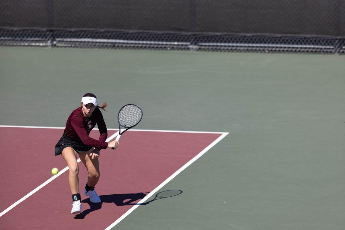 Junior Mary Stoiana goes to return the ball during Texas A&Ms match against Rice on Feb. 18, 2024 at the Mitchell Outdoor Tennis Center.