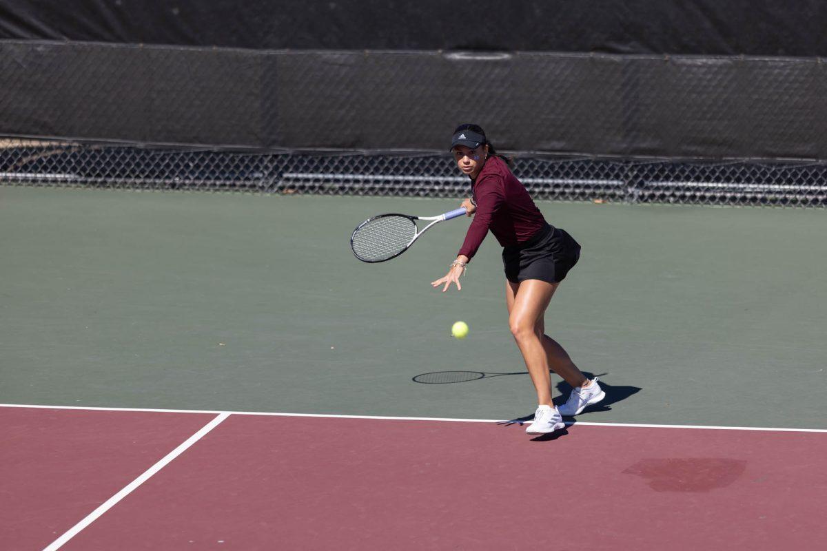 Sophomore Mia Kupres keeps her eye on the ball before hitting it during Texas A&Ms match against Rice on Feb. 18, 2024 at the Mitchell Outdoor Tennis Center.