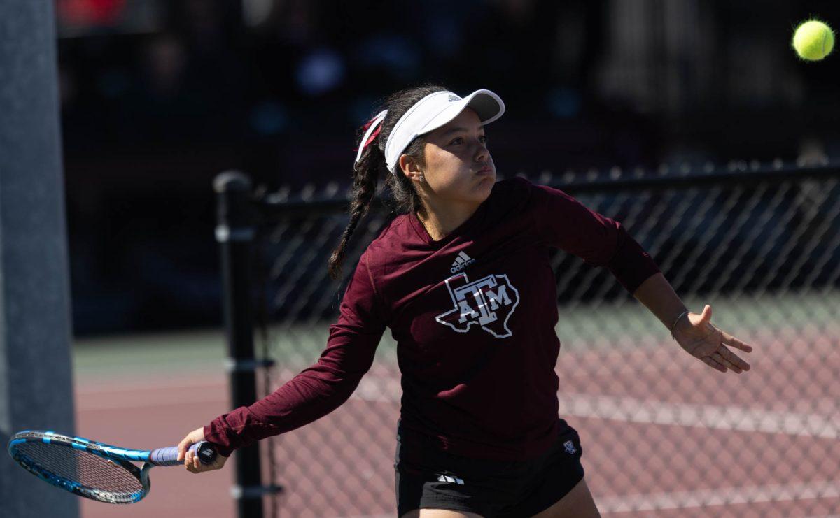 Freshman Lucciana Perez swings at the ball during Texas A&Ms match against Rice on Feb. 18, 2024 at the Mitchell Outdoor Tennis Center.
