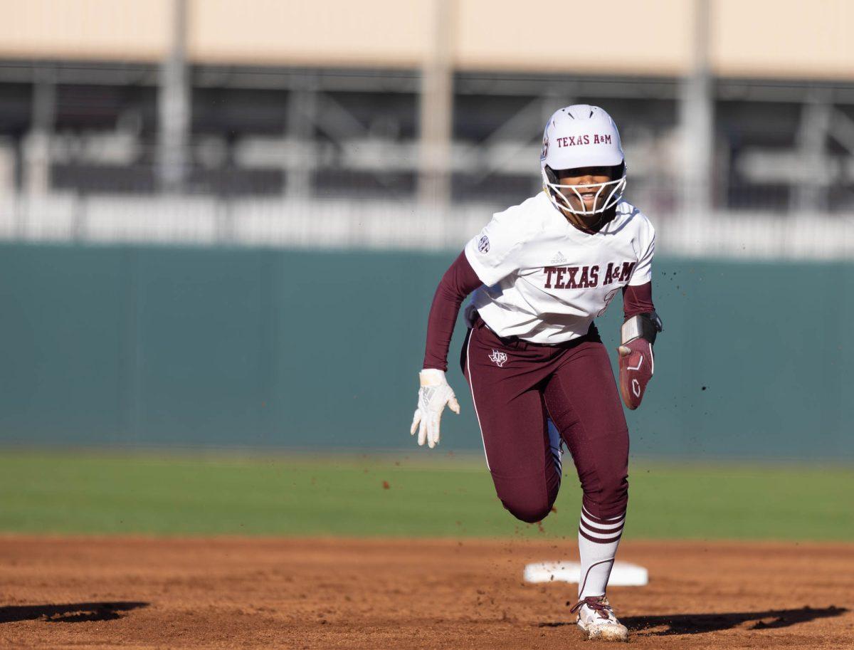 Junior INF Koko Wooley (3) runs to third base during Texas A&Ms game against St. Thomas on Feb. 23, 2024 at Davis Diamond. (Jaime Rowe/The Battalion)