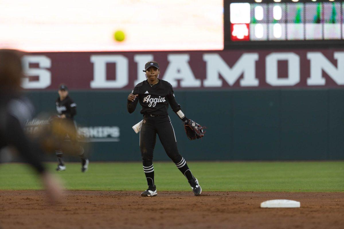 Junior INF Koko Wooley (3) passes the ball to second base during Texas A&Ms game against Kansas State on Feb. 24, 2024 at Davis Diamond. (Jaime Rowe/The Battalion)