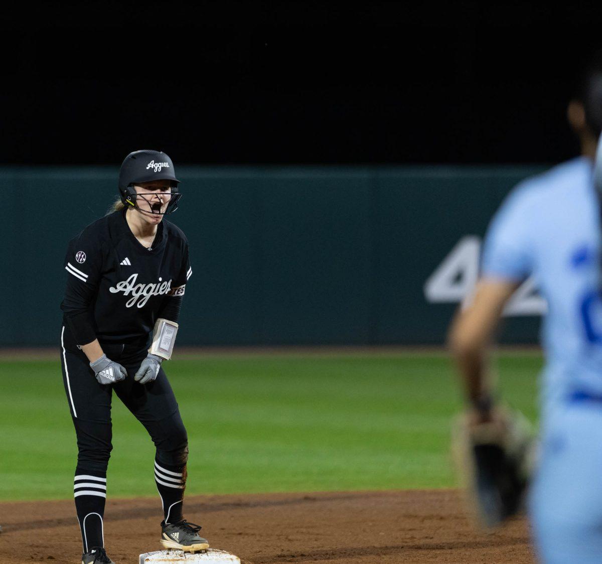 Senior C Julia Cottrill (42) celebrates during Texas A&Ms game against Kansas State on Feb. 24, 2024 at Davis Diamond. (Jaime Rowe/The Battalion)