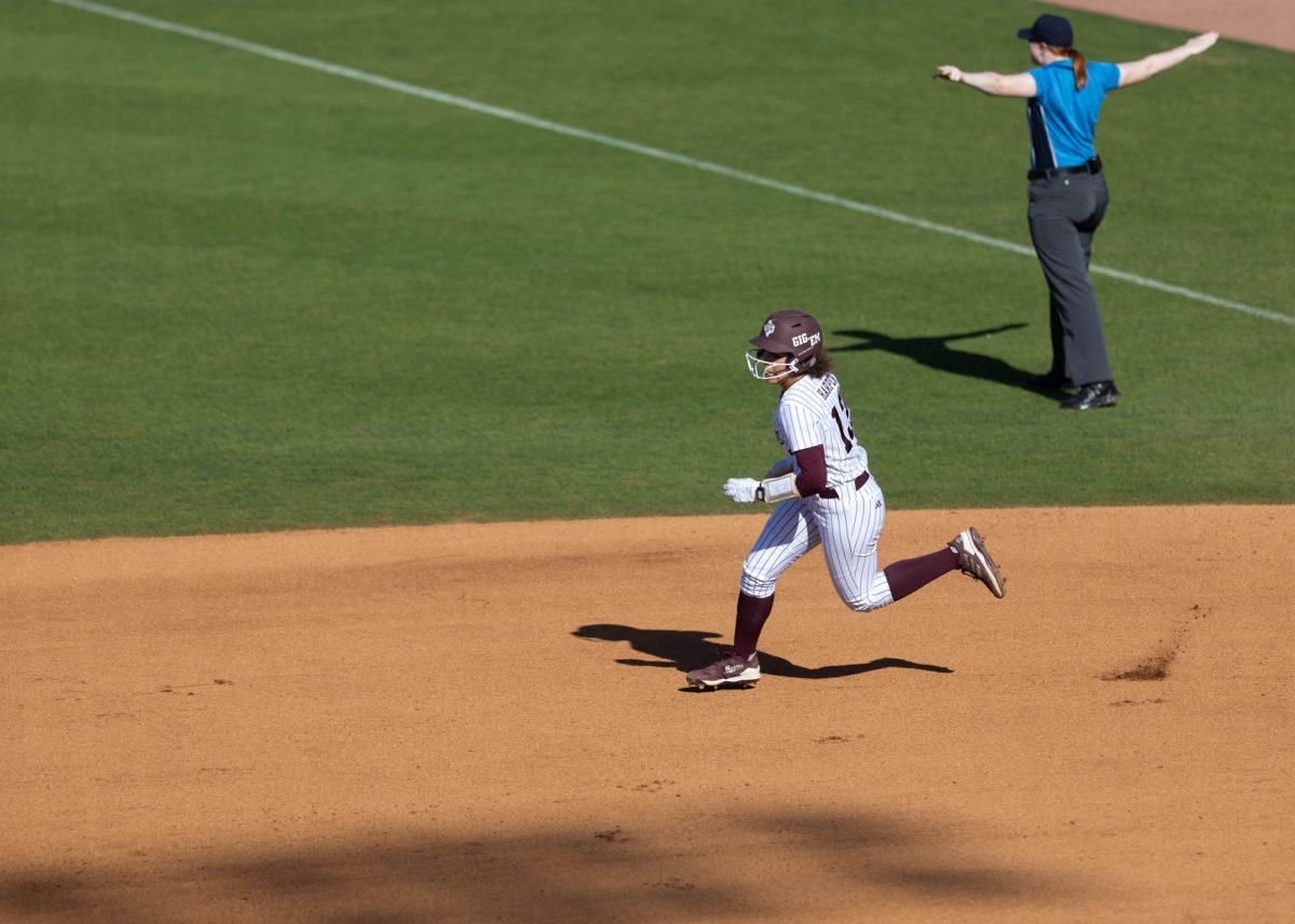 Sophomore INF Amari Harper (13) has a safe run during Texas A&Ms game against UTSA on Feb. 25, 2024 at Davis Diamond. (Jaime Rowe/The Battalion)