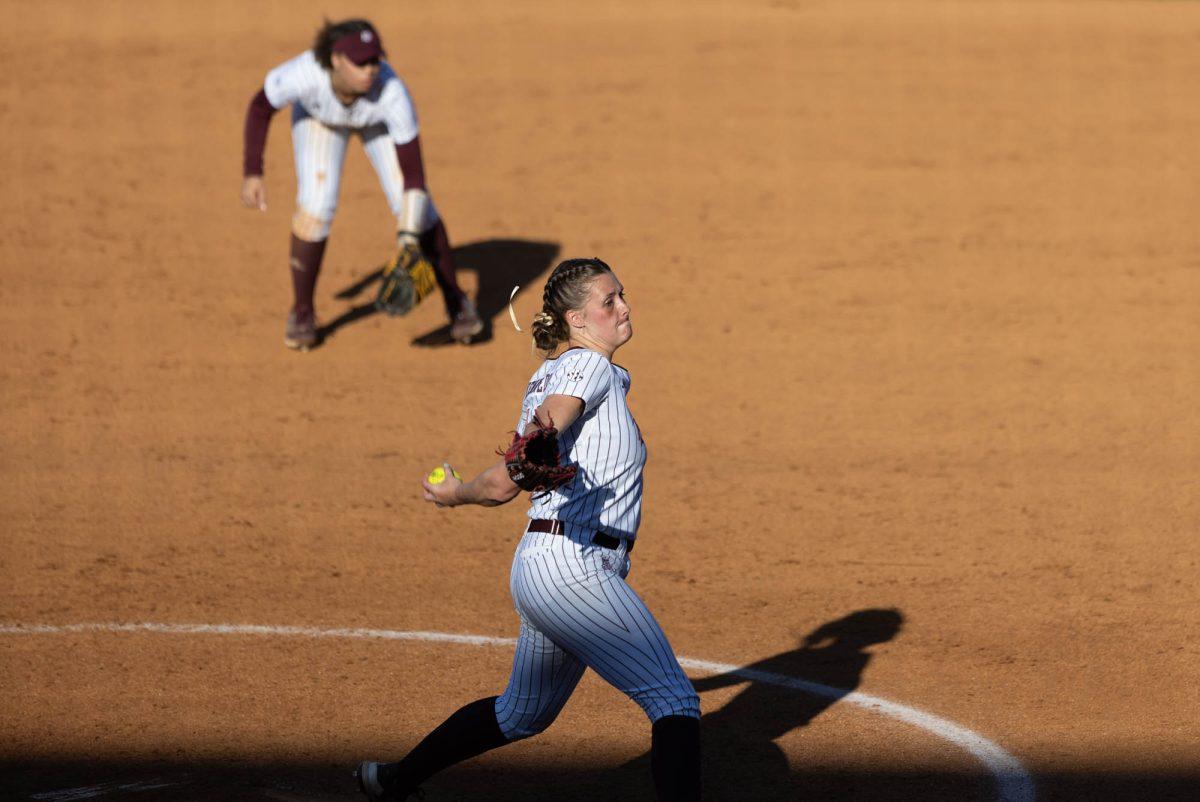 Junior P Emiley Kennedy (11) pitches during Texas A&Ms game against UTSA on Feb. 25, 2024 at Davis Diamond. (Jaime Rowe/The Battalion)