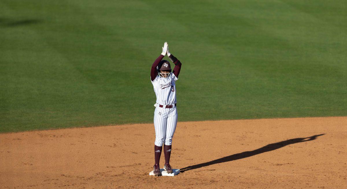 Junior INF Koko Wooley (3) celebrates an upheld call during Texas A&Ms game against UTSA on Feb. 25, 2024 at Davis Diamond. (Jaime Rowe/The Battalion)