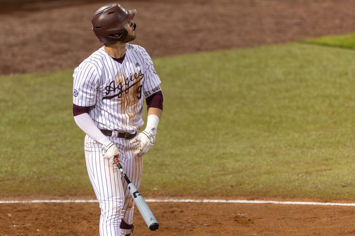 Freshman UTIL Gavin Grahovac (9) watches the ball after hitting a grand slam during A&M's game against Mississippi State on Thursday, March 21, 2024, at Olsen Field. (CJ Smith/The Battalion)