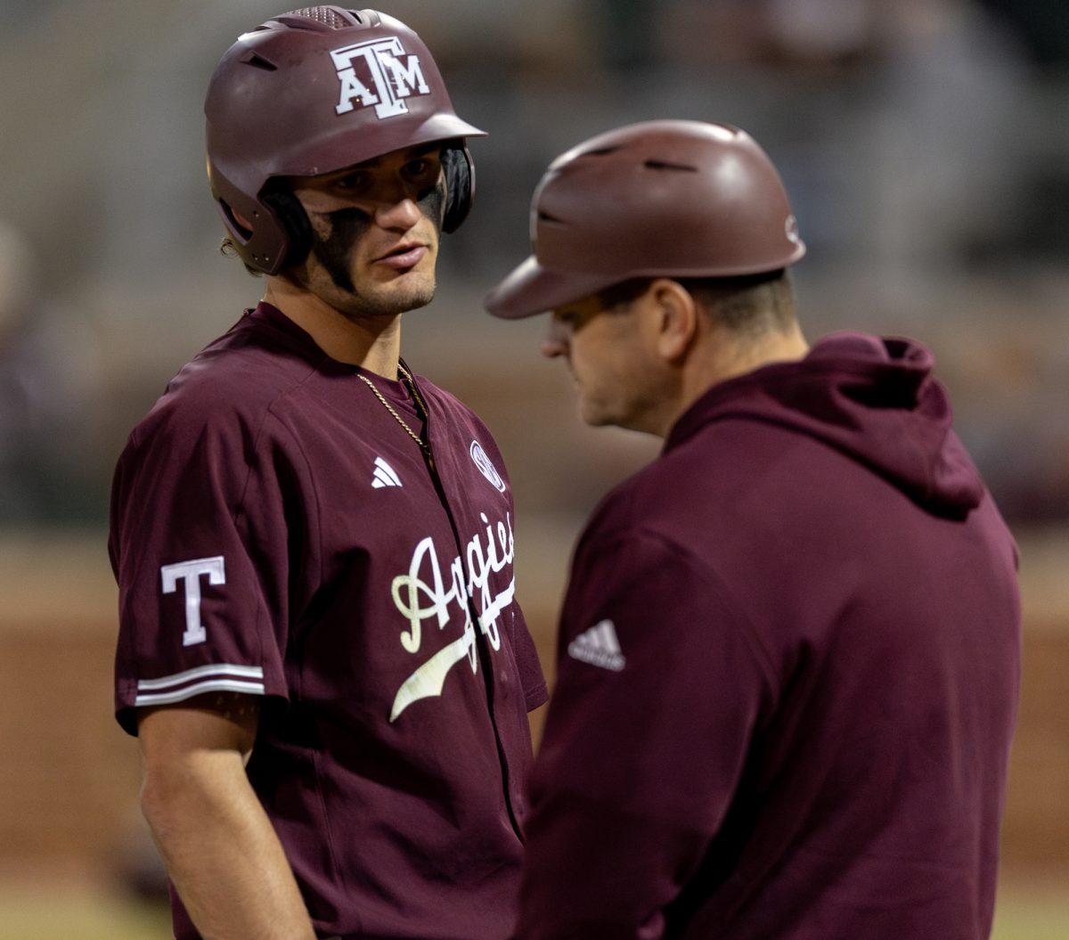 Sophomore OF Jace LaViolette (17) talks to Assistant Head Coach Nolan Cain during A&Ms games against Houston Christian University on Tuesday, March 26, 2024, at Olsen Field. (CJ Smith/The Battalion)