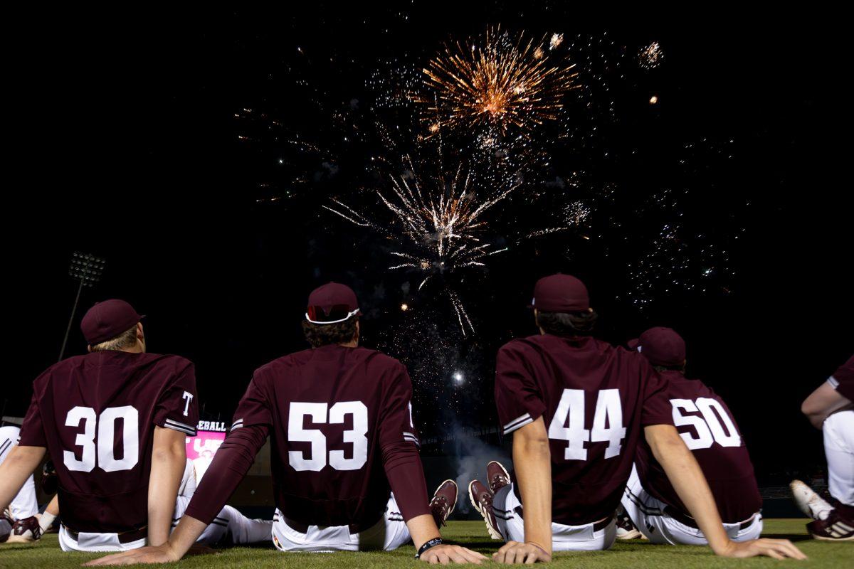 The Aggies watch fireworks after A&Ms game against Auburn on Friday, March 29, 2024, at Olsen Field. (CJ Smith/The Battalion)