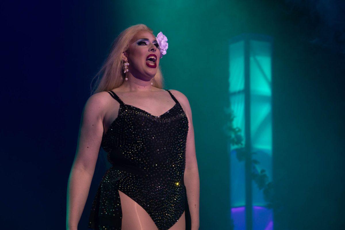 Drag queen Lily Adonis Kline performing to 'Roar' by Katy Perry during their head-to-head lip-sing battle with drag queen Hanna Santanna at the Draggieland show in Rudder Theater, Thursday March 28, 2024. (Ashely Bautista/The Battalion)