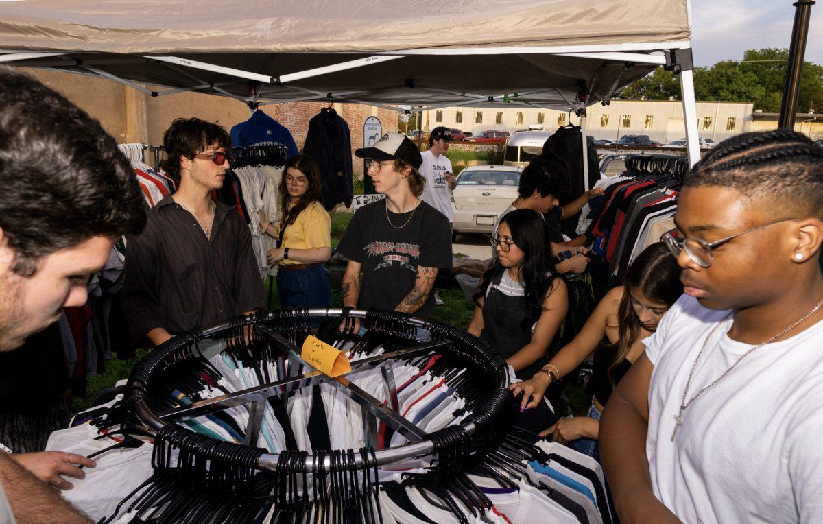 Customers browse vintage clothing together at the Bygone Vintage market on Friday, Oct. 6th, 2024 at Tavo Coffee Co.