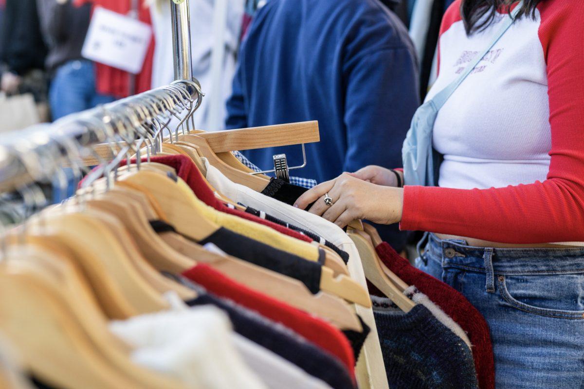 A customer browses vintage clothing at Bygone Vintages Backyard Bash on Saturday, Jan. 2th, 2024, and The Lakewalk.