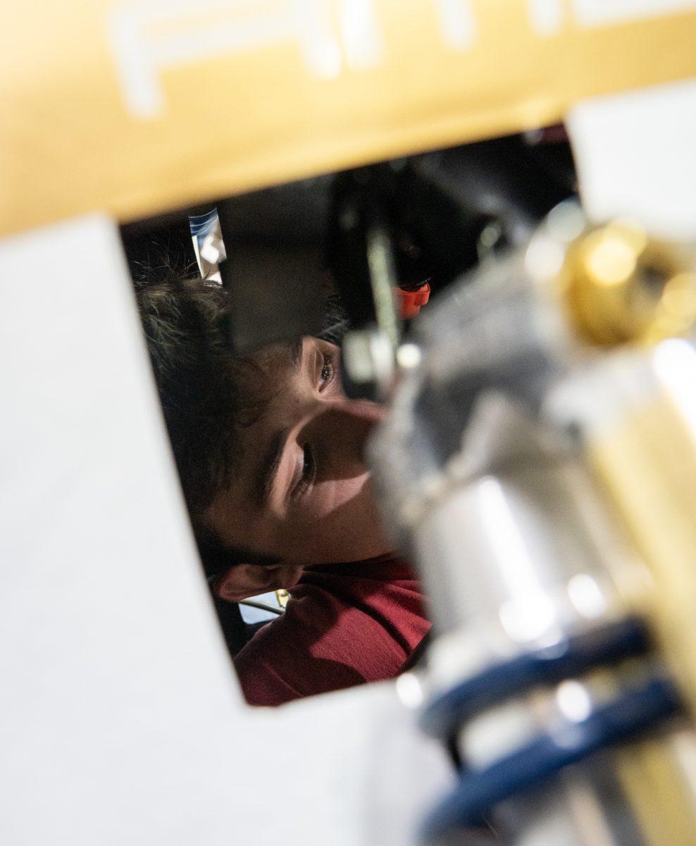 Aerodynamics lead and Junior Mechanical Engineer Phillip Bertschy 25 works on AME 24s nosecone before rollout on Sunday, Mar. 24th, 2024, at the SAE Workshop.