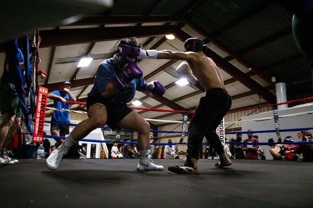 Fighter Jake Young throws a left cross at sparring partner Kim Peters during Farmers Fight NIght sparring practice on Tuesday, Feb. 20, 2024, at BCS Boxing Club.
