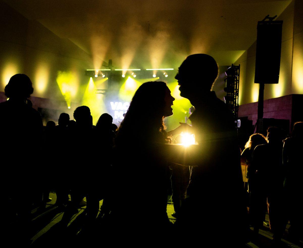 Attendees dance during Vacation Manors performance at Aggie Island Party on Saturday Mar. 23rd, 2024, at Wolf Pen Creek Amphitheater.