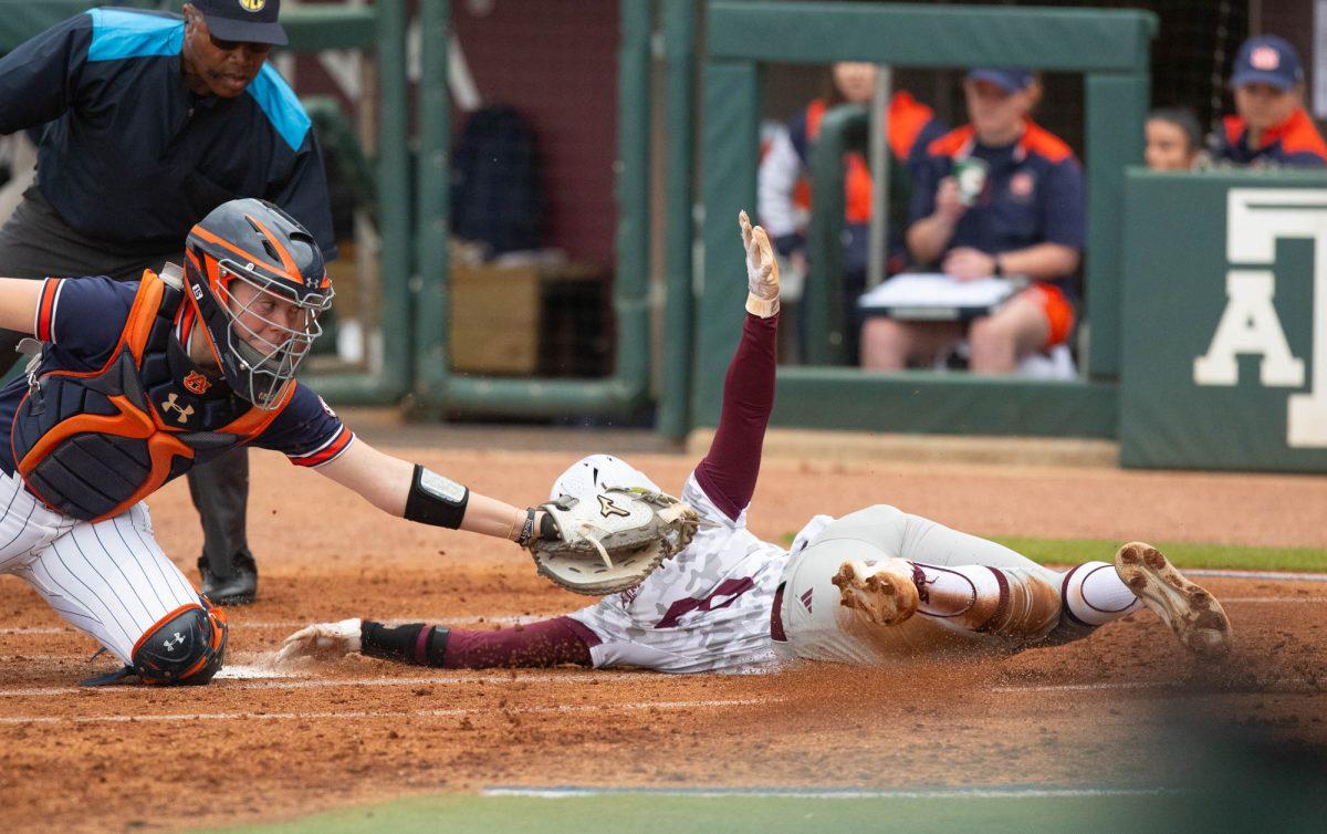 Texas A&M infielder Koko Wooley (3) slides into home during Texas A&Ms game against Auburn on Sunday, March 24, 2024, at Davis Diamond. (Lana Cheatham/The Battalion)