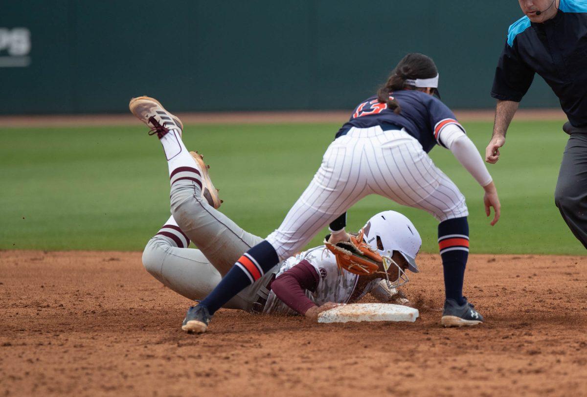 Texas A&M infielder Kennedy Powell (1) slides back to second base during Texas A&Ms game against Auburn on Sunday, March 24, 2024, at Davis Diamond. (Lana Cheatham/The Battalion)