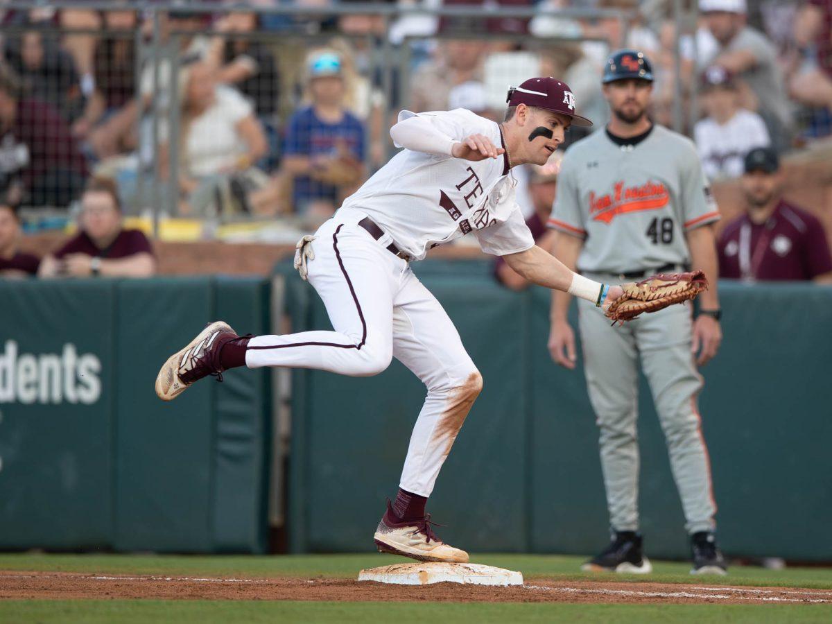 Texas A&M infielder Ted Burton (27) getting an out on first during Texas A&M’s game against Sam Houston State on Tuesday, March 12, 2024 at Olsen Field. (Hannah Harrison/The Battalion)
