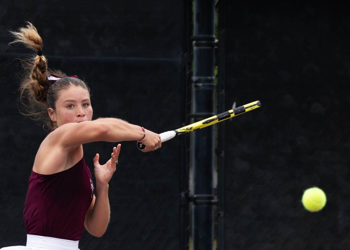 Junior Jeanette Mireles returns the ball at Texas A&M's match against Kentucky at the Outdoor Mitchell Tennis Center on Sunday, March 24, 2024. (Connor May/The Battalion)