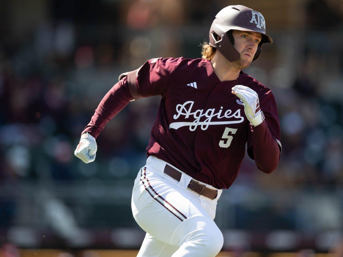 Texas A&M outfielder Hayden Schott (5) running to first base during Texas A&M’s game against Rhode Island on Saturday, March 9, 2024 at Olsen Field. (Hannah Harrison/The Battalion)