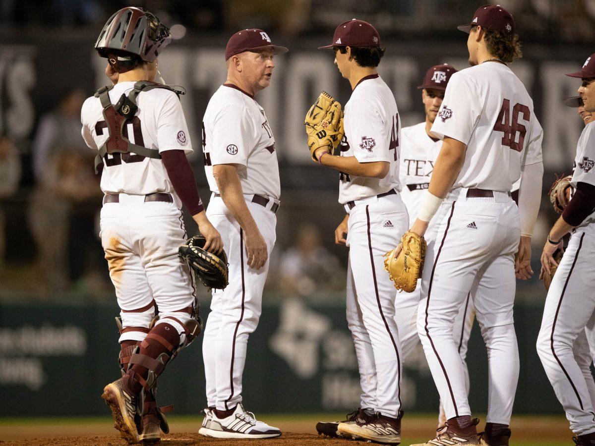 Texas A&M Head Coach Jim Schlossnagle talking on the mound during Texas A&M’s game against Sam Houston State on Tuesday, March 12, 2024 at Olsen Field. (Hannah Harrison/The Battalion)