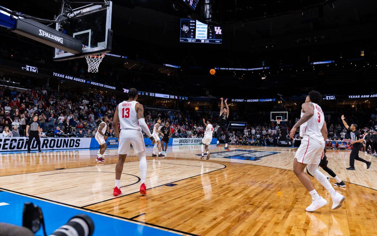 Forward Andersson Garcia (11) hits a game-tying 3-pointer at the end of regulation during Texas A&amp;M's game against Houston in the second round of the 2024 NCAA Tournament at FedExForum in Memphis, Tennessee, on Sunday, March 24, 2024.