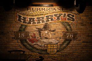 Hurricane Harry's painting adorning wall behind the dance floor. (Adriano Espinosa/The Battalion)