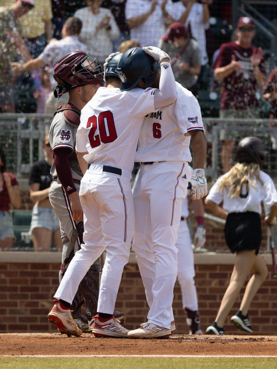 Senior C Jackson Appel (20) hugs Junior OF Braden Montgomery (6) during Texas A&Ms game against Mississippi State on March 23rd, 2023 at Olsen Field. (Jaime Rowe/The Battalion)