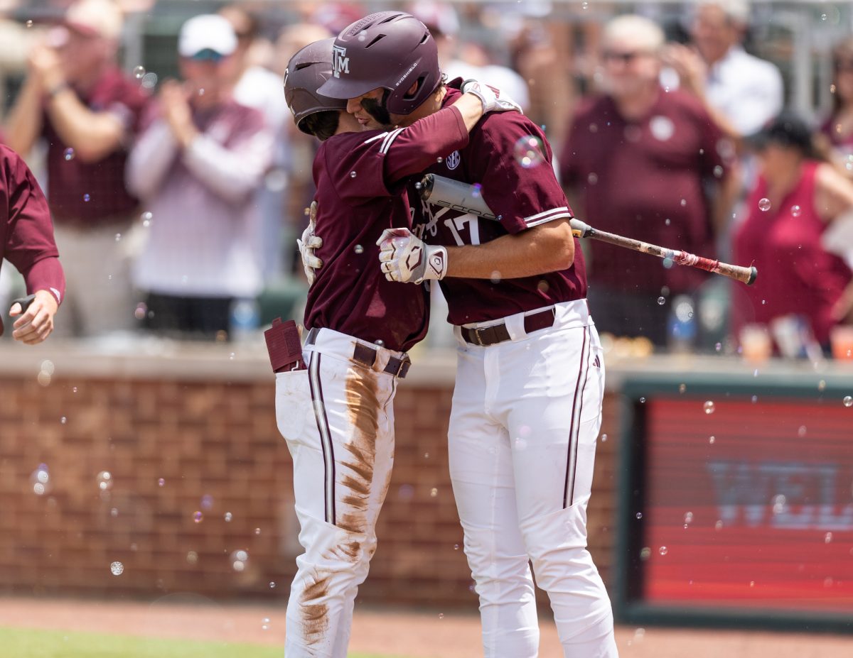 Texas A&M utility Travis Chestnut (4) hugs outfielder Jace LaViolette (17) during A&Ms game against Georgia on Saturday, April 27, 2024, at Olsen Field. (CJ Smith/The Battalion)