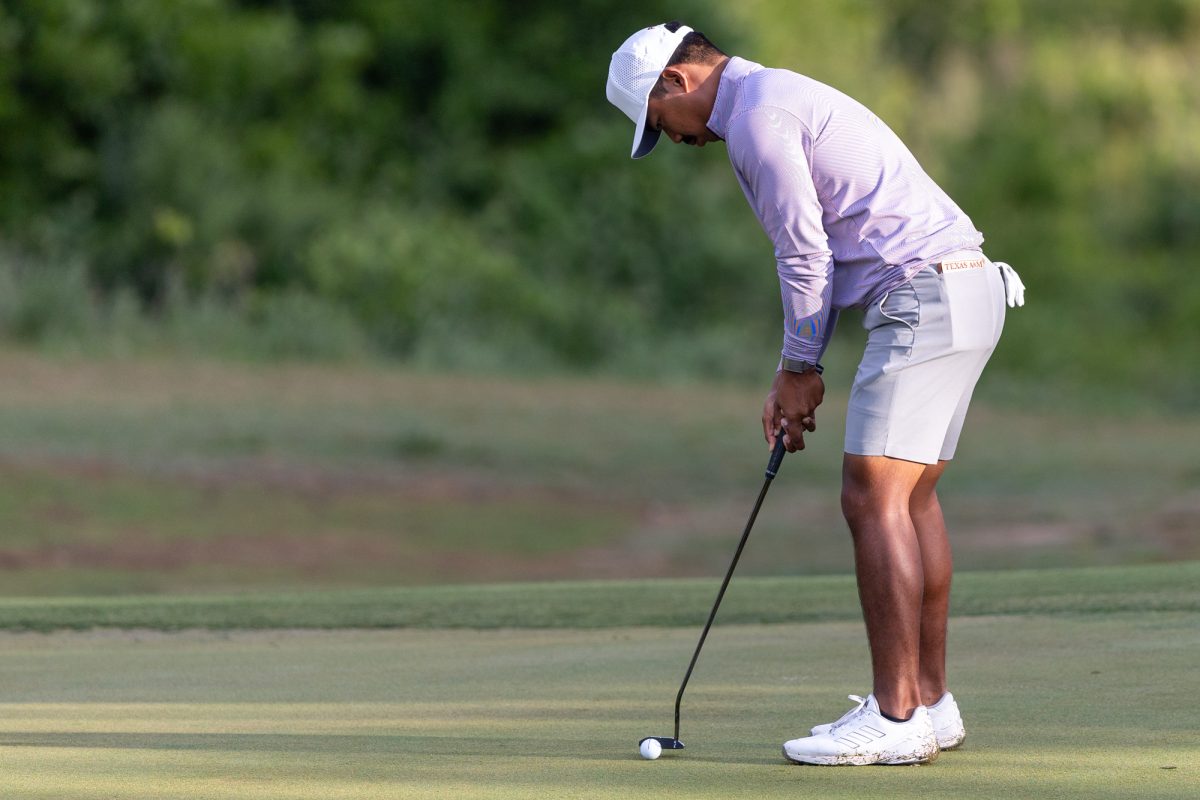 Texas A&amp;M junior Phichaksn Maichon putts the ball during The Aggie Invitational on Saturday, April 6, 2024, at Traditions Golf Club. (CJ Smith/The Battalion)