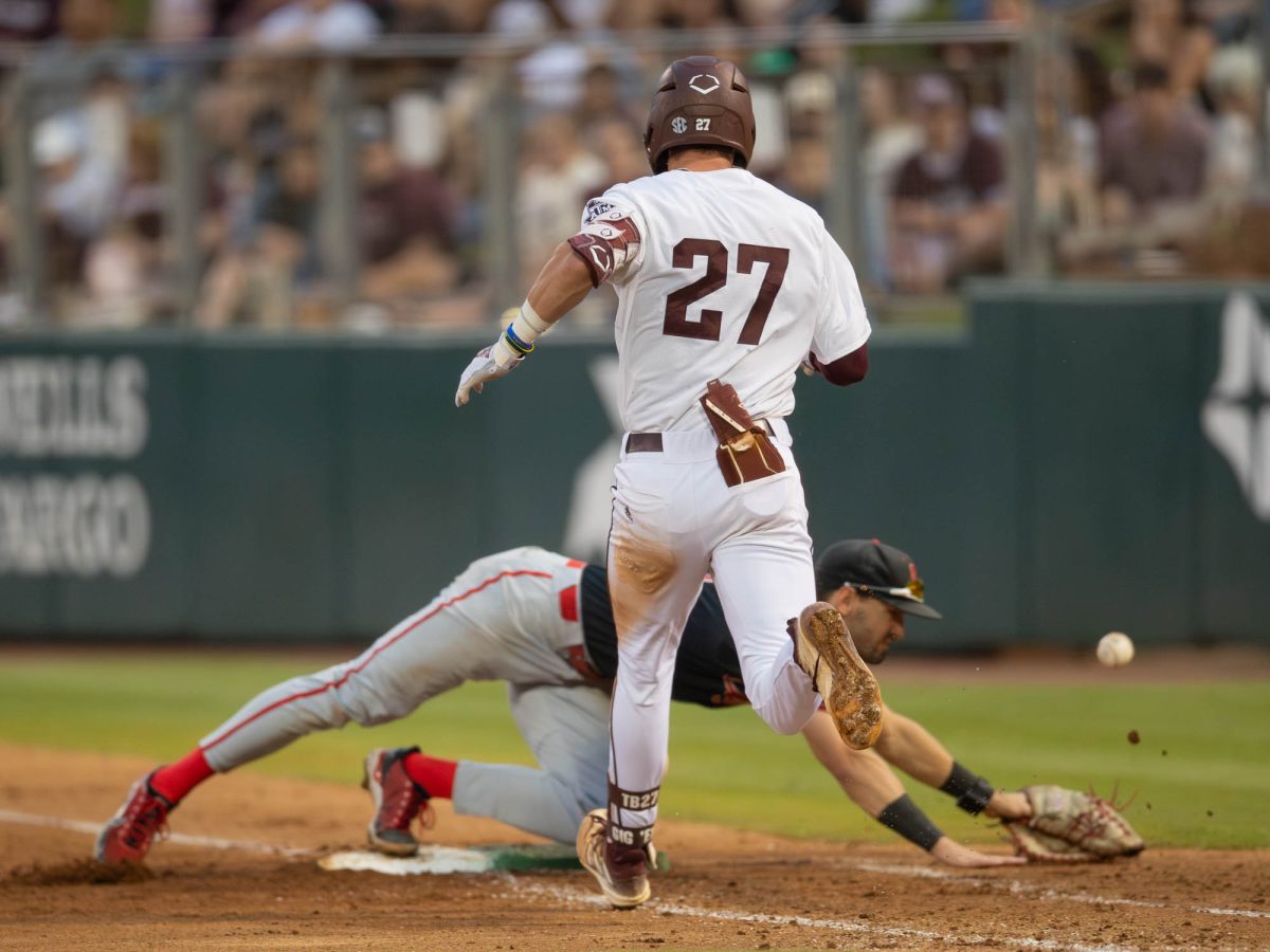 Texas A&M infielder Ted Burton (27) running to first because of a U of H error during Texas A&M’s game against The University of Houston on Tuesday, April 23, 2024 at Olsen Field (Hannah Harrison/The Battalion)