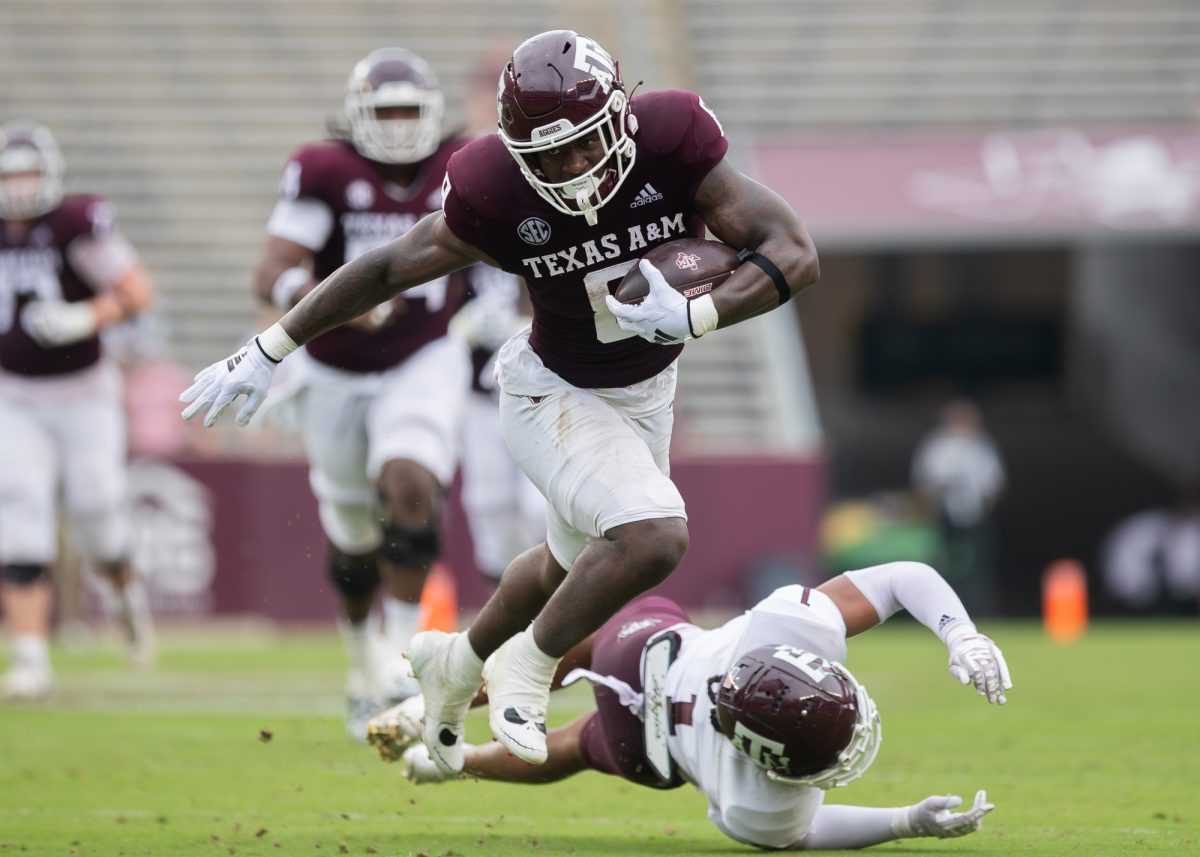 Junior RB Le'Veon Moss (8) breaks a tackle during Texas A&amp;M's Spring Game at Kyle Field on Saturday, April 20, 2024. (Adriano Espinosa/The Battalion)