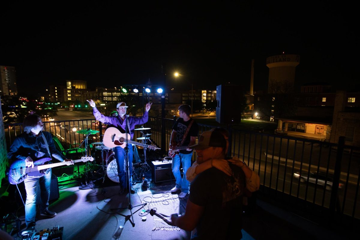 The Highway 6 Band performs while listeners slow dance at The Corner Bar and Rooftop Grill on Sunday, March 24, 2024. (Chris Swann/The Battalion)