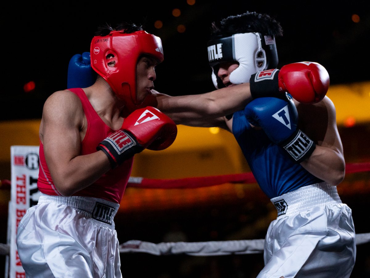 Light Middleweight boxers Francis Cristal and Frank Chiu throw crosses during Farmers Fight Night on Thursday, April 4th, 2024, at Reed Arena.