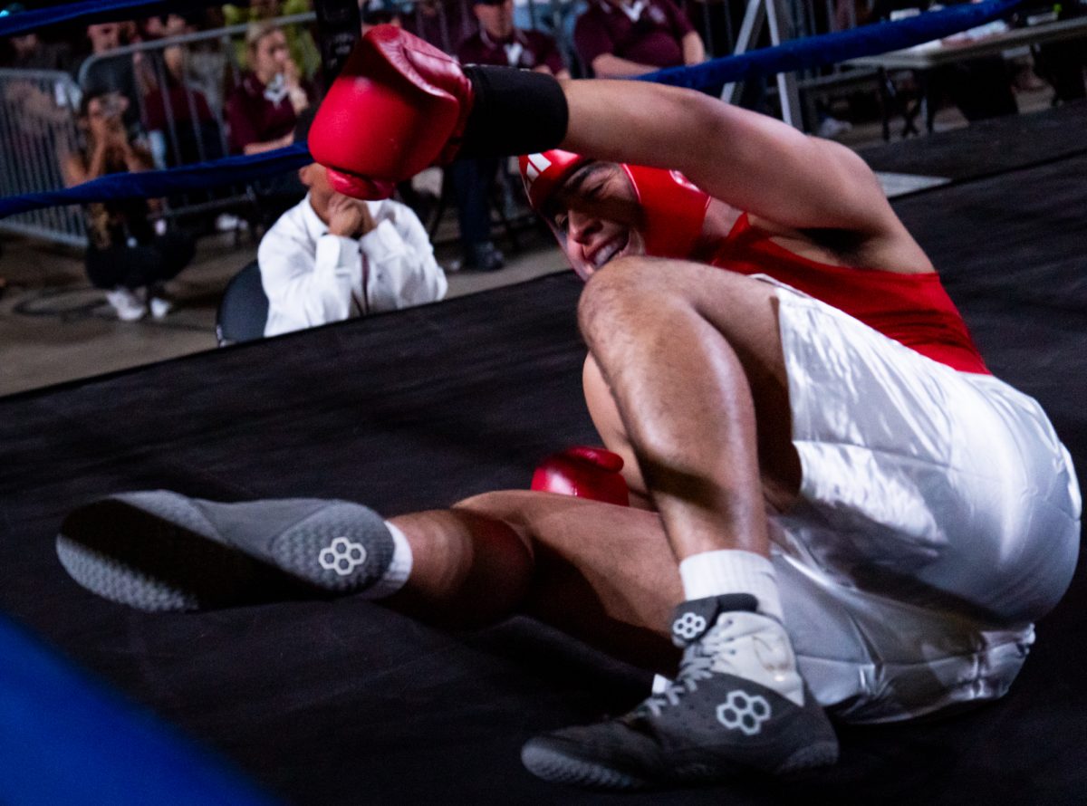 Heavyweight fighter Kobe Mora falls during Farmers Fight Night on Thursday, April 4th, 2024, at Reed Arena.