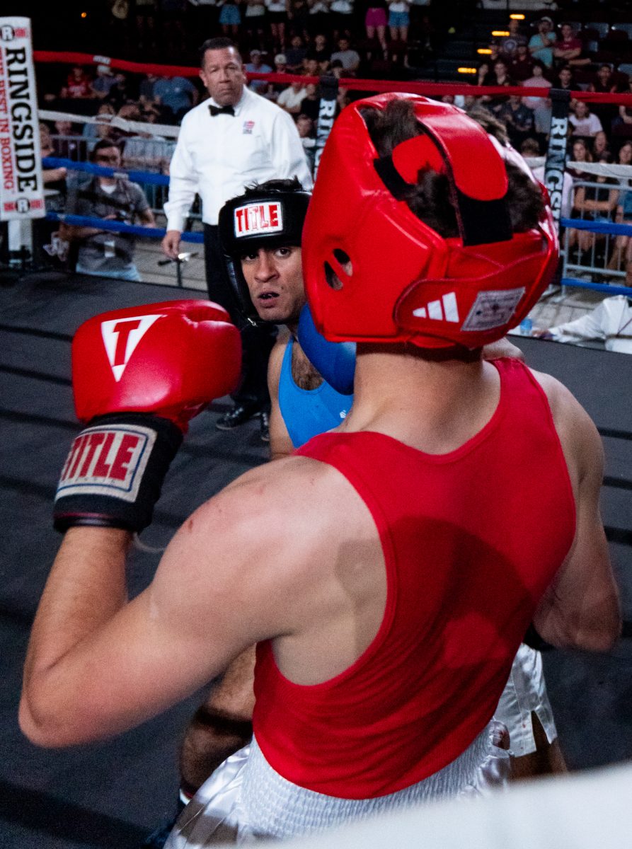 Light Heavyweight fighter Emiliano Sanchez uppercuts opponent AJ Baird in the corner during Farmers Fight Night on Thursday, April 4th, 2024, at Reed Arena.
