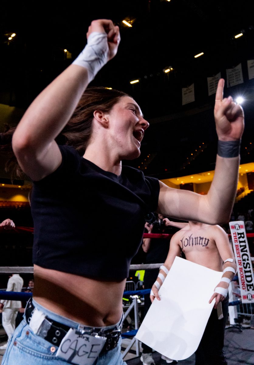 Welterweight fighter Tom Sengphets supporters cheer in the ring before his fight during Farmers Fight Night on Thursday, April 4th, 2024, at Reed Arena.