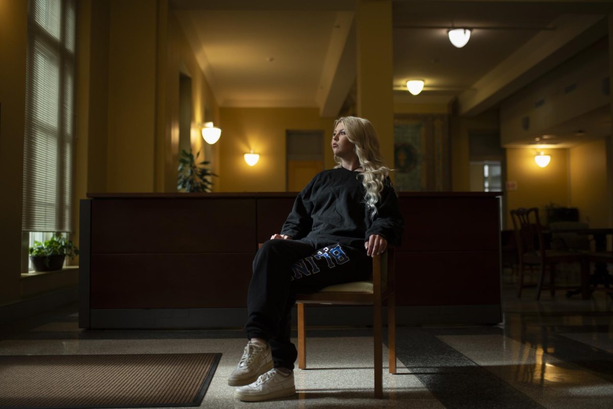 Kennedy White, 19, sits for a portrait in the sweats she wore the night of her alleged assault inside the Y.M.C.A building that holds Texas A&M’s Title IX offices in College Station, Texas on Feb. 16, 2024 (Ishika Samant/The Battalion).