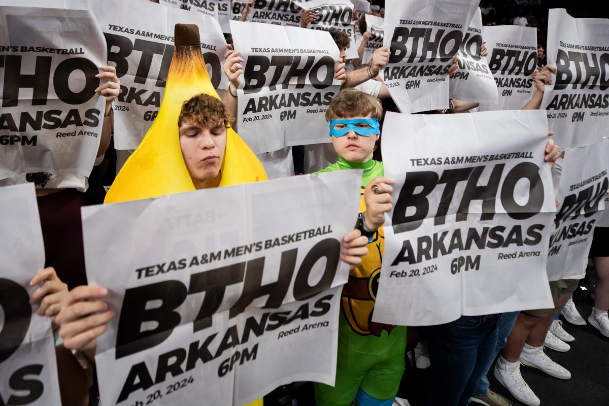 Agricultural economics junior Jacob Bush and sport management sophomore Sam Stovall read the paper before Texas A&M's game against Arkansas at Reed Arena on Tuesday, Feb. 20, 2024.