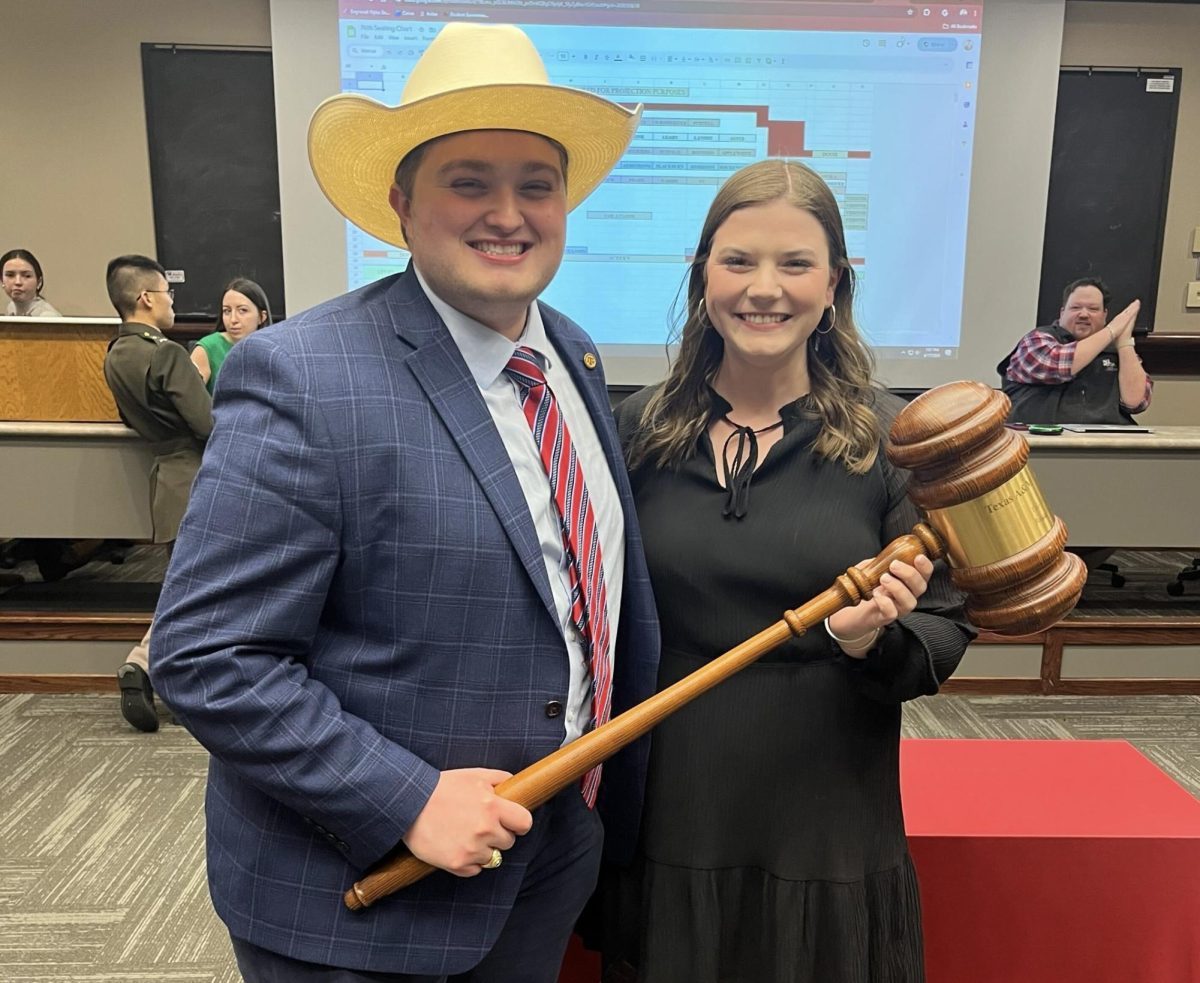 76th Speaker of the Senate Marcus Glass, left, poses with incoming 77th Speaker of the Senate Ava Blackburn.