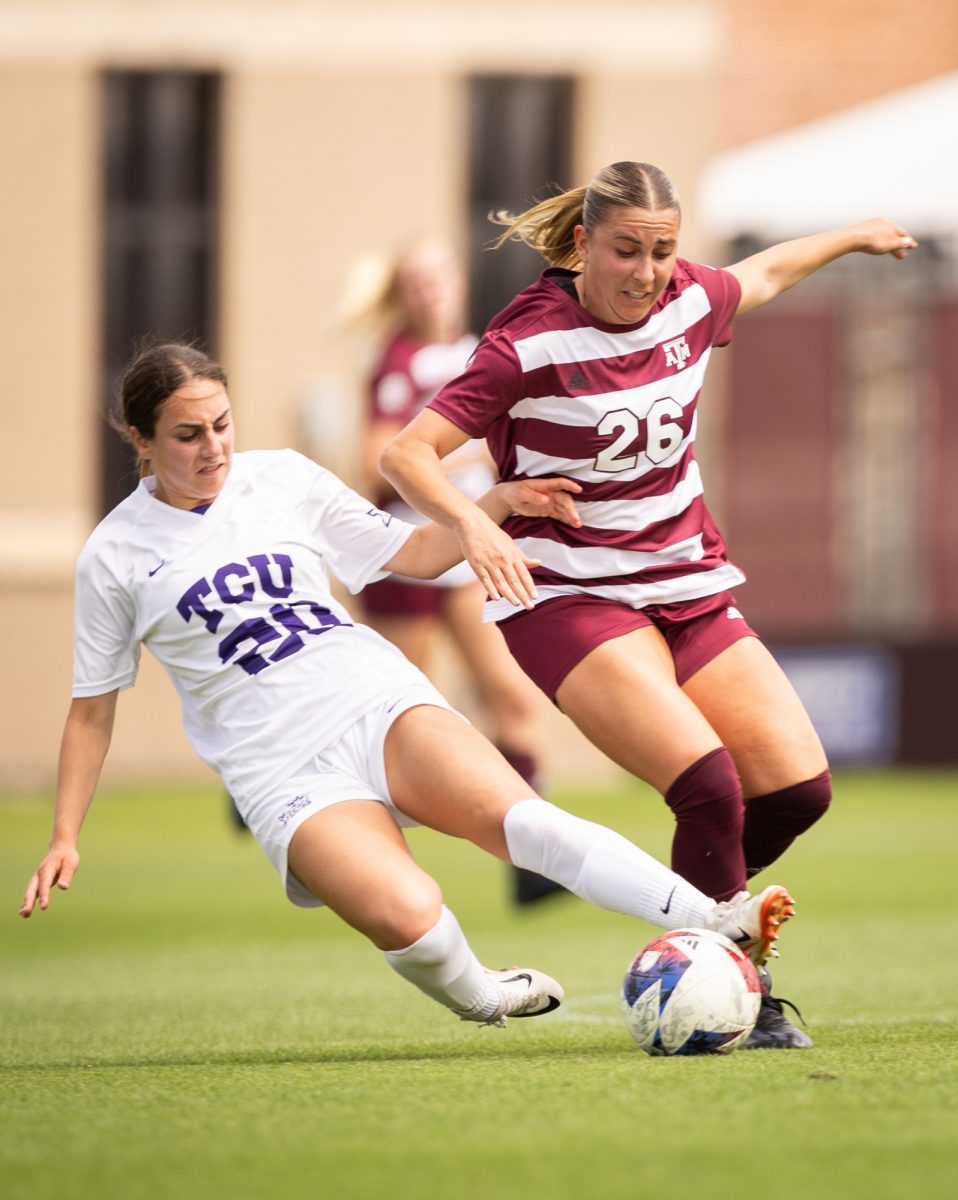 TCU Graduate MF Sara Brocious (25) slide tackles Junior M Leah Pirro (26) during Texas A&Ms game against TCU on Sunday, April 7, 2024, at Ellis Field.