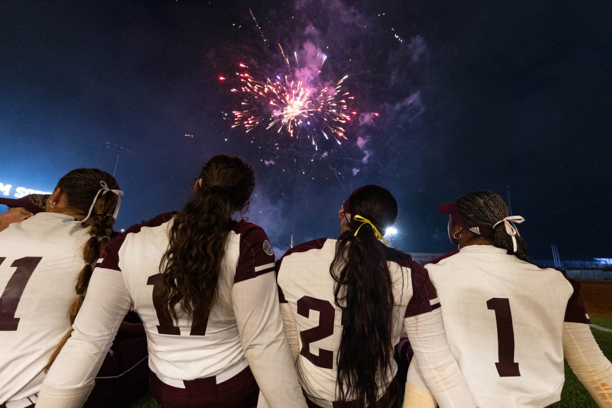 Texas A&M players watch fireworks after Texas A&M’s game against Ole Miss on Friday, April 19, 2024 at Davis Diamond. (Hannah Harrison/The Battalion)