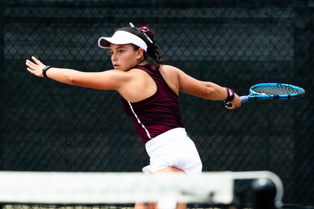 Freshman Lucciana Perez prepares to return a serve at Texas A&Ms match against Alabama at the Outdoor Mitchell Tennis Center on Sunday, April 14, 2024. [Connor May/The Battlion ©]