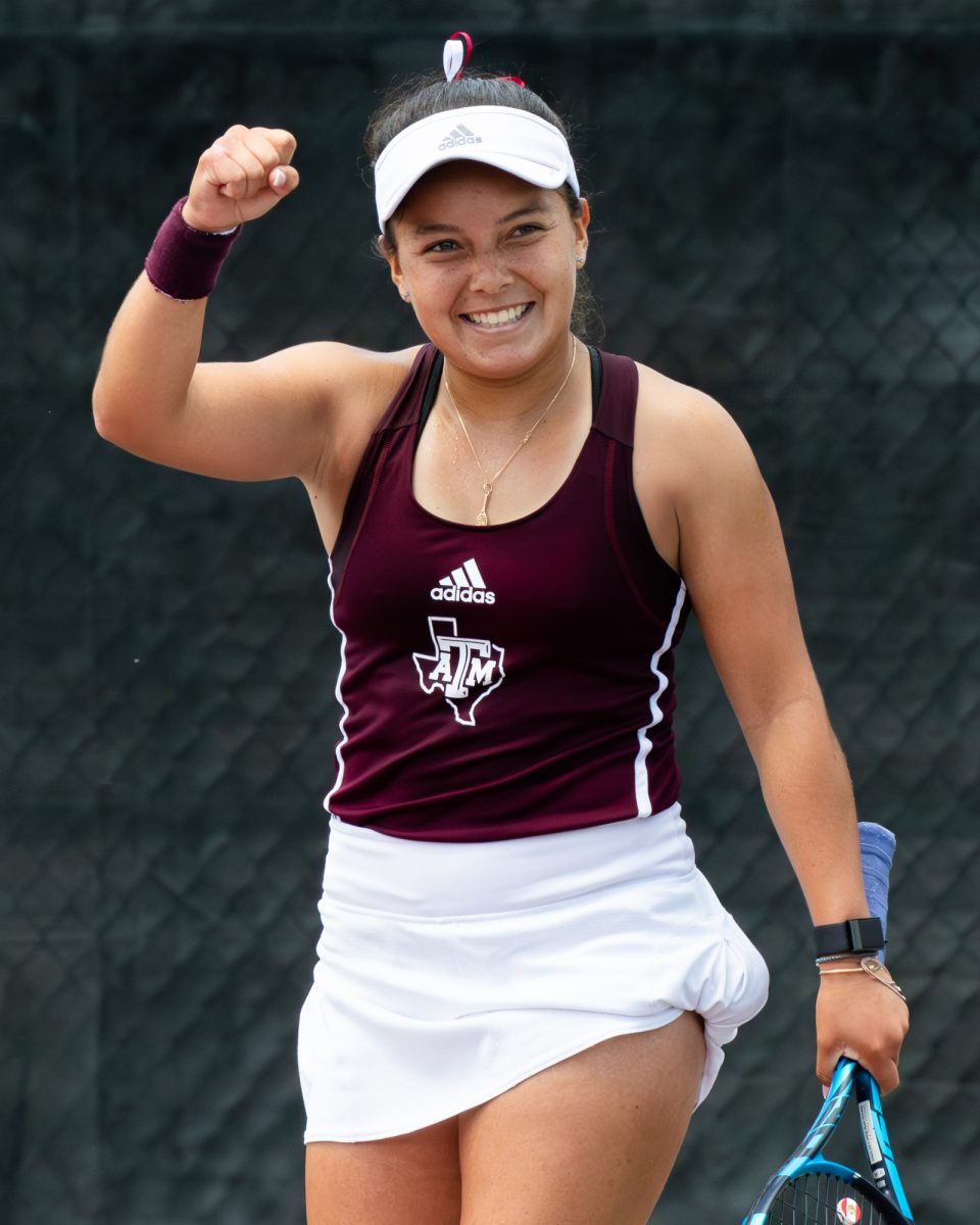 Freshman Lucciana Perez reacts to the match winning point at Texas A&M's match against Alabama at the Outdoor Mitchell Tennis Center on Sunday, April 14, 2024. [Connor May/The Battlion ©]