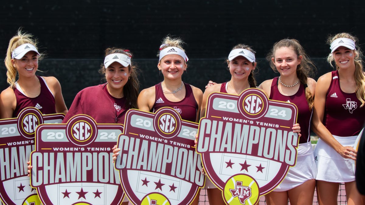 The Texas A&M Women's Tennis team poses after securing tehir third straight SEC title at Texas A&M's match against Alabama at the Outdoor Mitchell Tennis Center on Sunday, April 14, 2024. [Connor May/The Battlion ©]